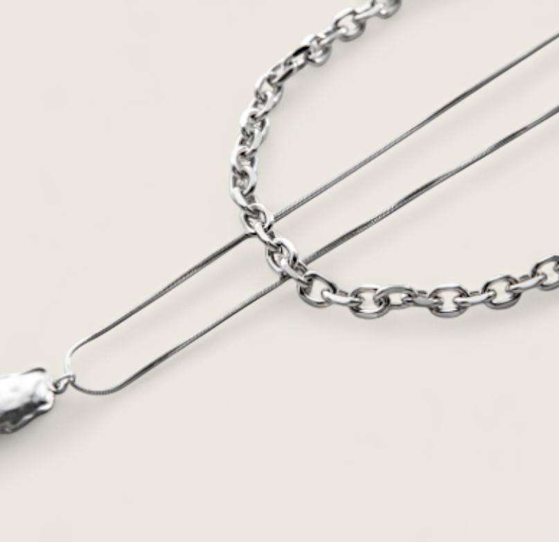 Molten Arc Duo Necklace-Fuel your look with layered steel chains and molten nugget pendant. Bold Voltage style with adjustable curb and snake chains. Shop now.