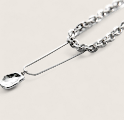 Molten Arc Duo Necklace-Fuel your look with layered steel chains and molten nugget pendant. Bold Voltage style with adjustable curb and snake chains. Shop now.