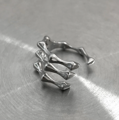 The Ossuary – Triple Bone Band-Bring a spine-tingling edge with the Ossuary Band. Sculpted steel bone-bar arches, bold open-band design, and darkened details. Shop now.