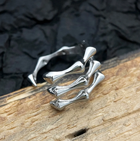 The Ossuary – Triple Bone Band-Bring a spine-tingling edge with the Ossuary Band. Sculpted steel bone-bar arches, bold open-band design, and darkened details. Shop now.