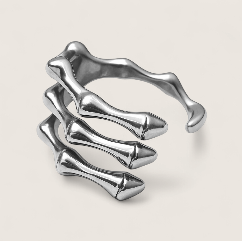 The Ossuary – Triple Bone Band-Bring a spine-tingling edge with the Ossuary Band. Sculpted steel bone-bar arches, bold open-band design, and darkened details. Shop now.