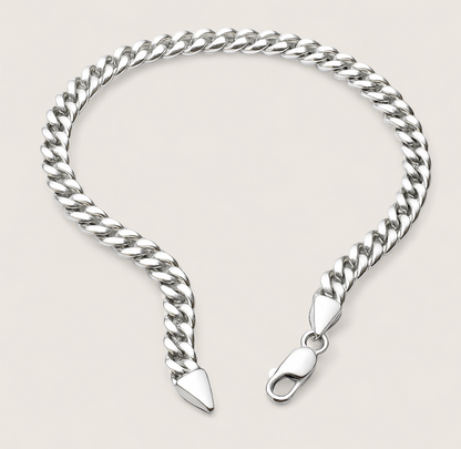 The Argent Curb – 5.8mm Sterling Silver Chain-5.8mm solid sterling silver curb chain. Polished flat links, crafted in Italy. Clean, bold silhouette—perfect solo or layered. Shop now.