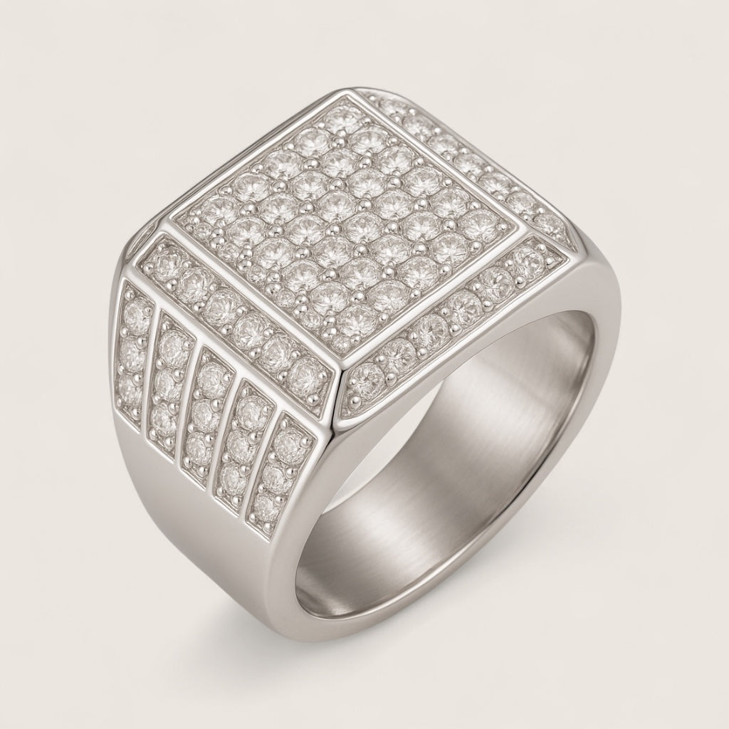 The Sovereign – 18 mm Iced Signet Ring-Elevate your look with the Sovereign Signet Ring. 18mm steel top pavé-set with CZ stones. Polished silver or gold finish. Bold, brilliant style. Shop now.