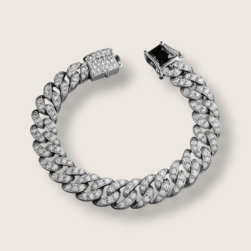 The Avalanche – 12.5 mm Iced Curb Chain-Make an impact with the Avalanche Iced Curb Chain. 12.5mm CZ-encrusted gold or silver chain with secure clasp. Available as bracelet or necklace. Shop now.