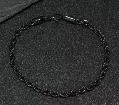 The Obsidian – 4 mm Rope Chain Bracelet-Slim 4mm black rope bracelet with fluid, woven texture. Matte black finish for stealthy, modern style. Perfect solo or layered. Shop now.