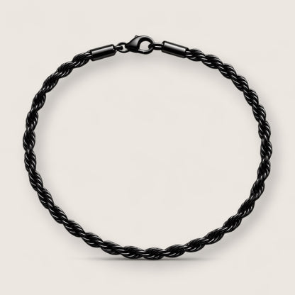 The Obsidian – 4 mm Rope Chain Bracelet-Slim 4mm black rope bracelet with fluid, woven texture. Matte black finish for stealthy, modern style. Perfect solo or layered. Shop now.