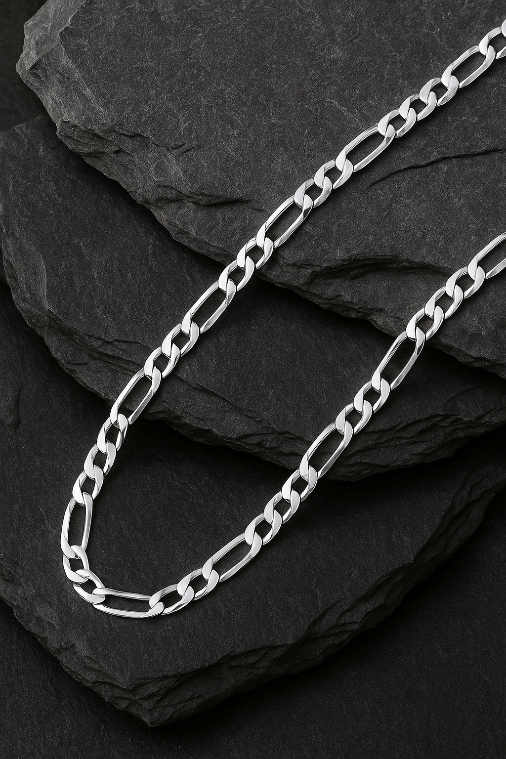 The Argent Figaro – 5.7mm Sterling Silver Chain-Bold 5.7mm sterling silver Figaro chain, diamond-cut for texture and shine. Crafted in Italy. A timeless statement piece. Shop now.