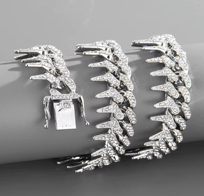 The Frostbite – 22″ Spiked Iced Cuban Chain-Strike with Frostbite. 20mm iced Cuban chain with CZ stones and razor-edged links. 22" of bold, high-voltage energy and cold precision. Shop now.
