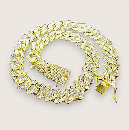 The Drip – Iced-Out Cuban Link Chain-Meet The Drip—14mm iced Cuban chain plated in silver or gold and pavé-set with sparkling rhinestones. Street-wise swagger, bold brilliance. Shop now.