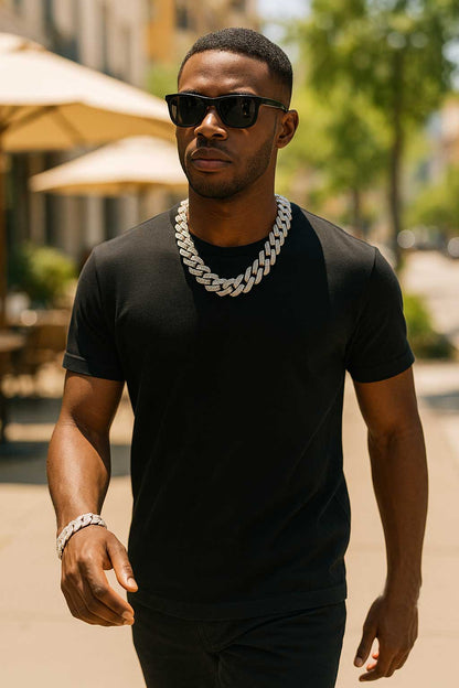 The Drip – Iced-Out Cuban Link Chain-Meet The Drip—14mm iced Cuban chain plated in silver or gold and pavé-set with sparkling rhinestones. Street-wise swagger, bold brilliance. Shop now.