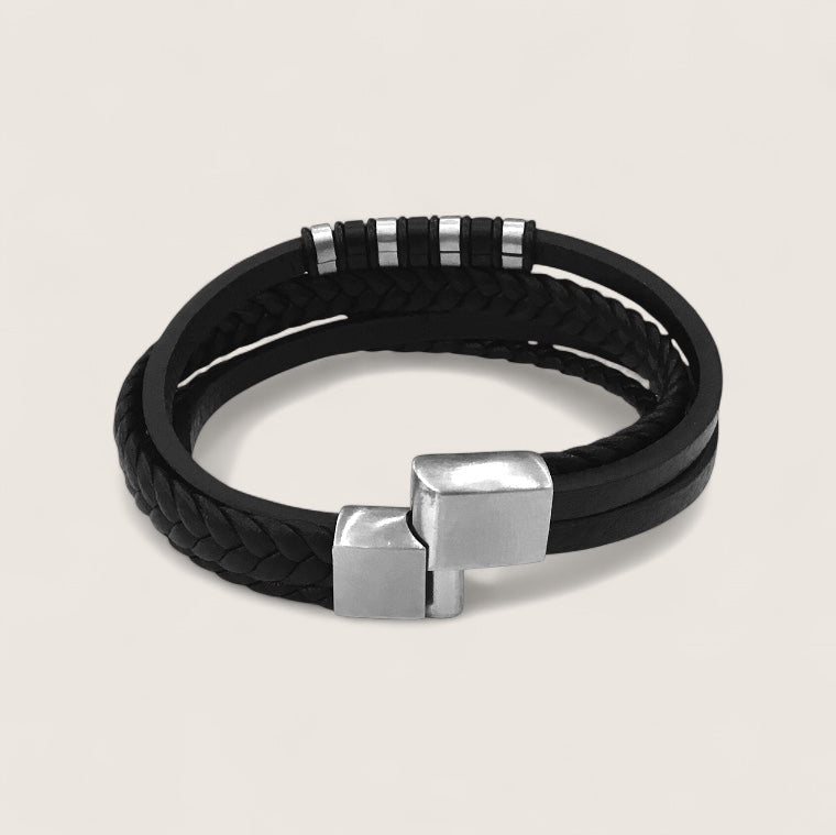 The IronPattern – Leather & Steel Bracelet-Triple-layer leather with a bold steel centerpiece. Rugged texture meets modern precision. Forge your look.