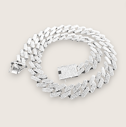 The Drip – Iced-Out Cuban Link Chain-Meet The Drip—14mm iced Cuban chain plated in silver or gold and pavé-set with sparkling rhinestones. Street-wise swagger, bold brilliance. Shop now.