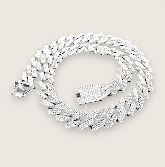 The Drip – Iced-Out Cuban Link Chain-Meet The Drip—14mm iced Cuban chain plated in silver or gold and pavé-set with sparkling rhinestones. Street-wise swagger, bold brilliance. Shop now.