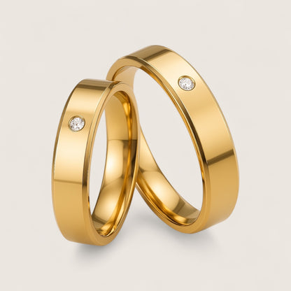 The Solis Solitaire – Flat Stainless Steel Ring-Discover The Solis Solitaire: a sleek 4 mm or 6 mm flat stainless steel ring in silver or gold finish, featuring a bezel-set CZ for refined minimalism. Shop Now