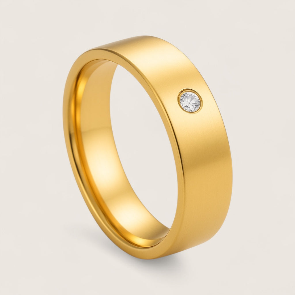 The Solis Solitaire – Flat Stainless Steel Ring-Discover The Solis Solitaire: a sleek 4 mm or 6 mm flat stainless steel ring in silver or gold finish, featuring a bezel-set CZ for refined minimalism. Shop Now