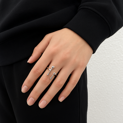 Reactor Drip – Statement Ring-Channel raw energy with the Reactor Drip Ring. Polished steel, sculptural open-band design with opposing arcs. Adjustable fit. Shop now.